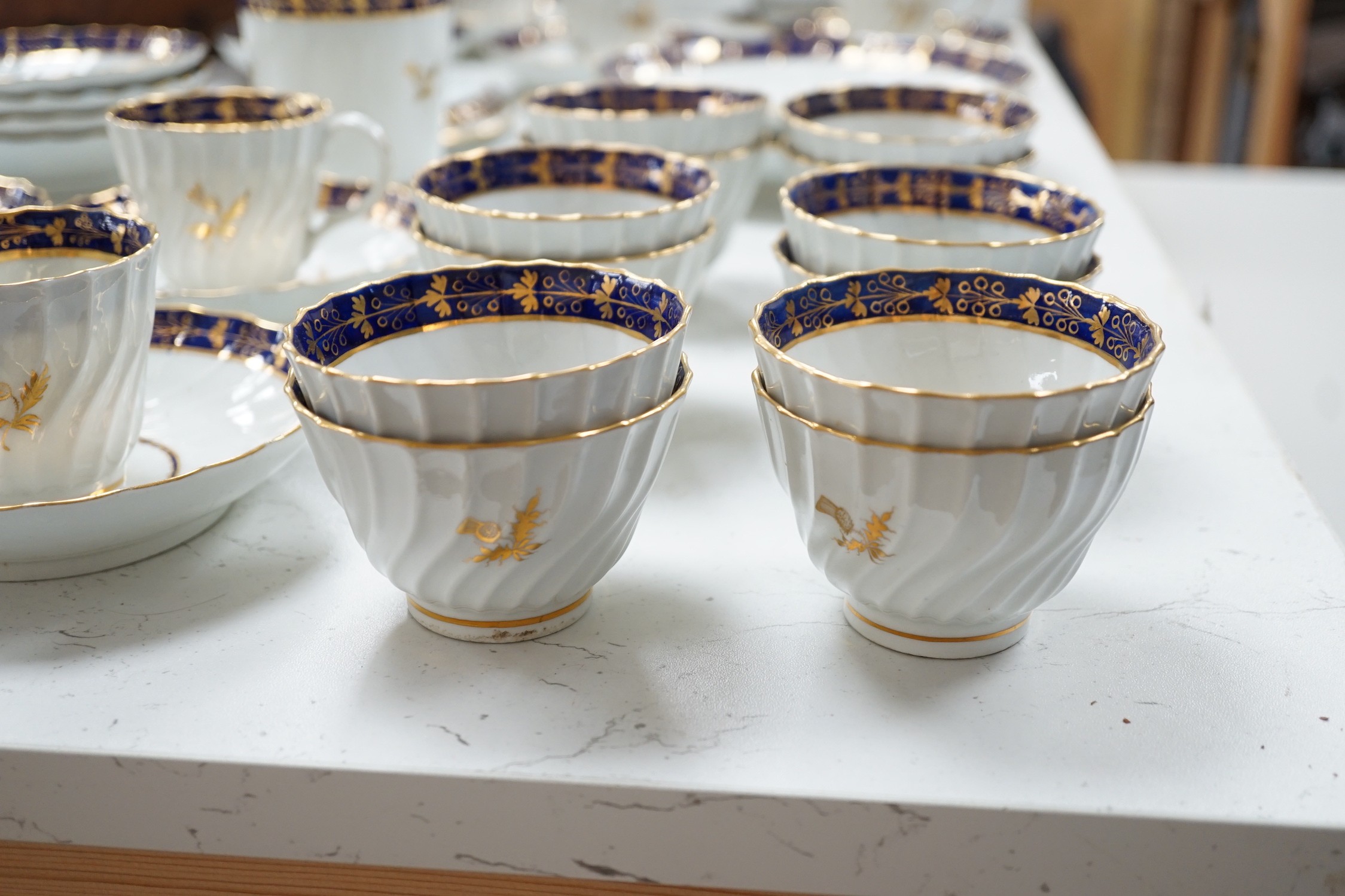 A Flight and Barr, Worcester blue and gilt bordered part tea and coffee service, c.1795, incised B marks